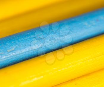 yellow and blue pencils as background