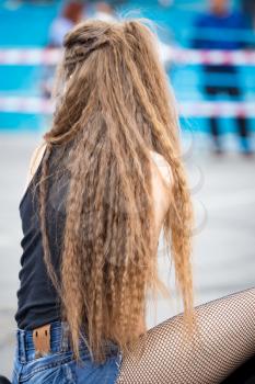 Long hair of a girl in the park