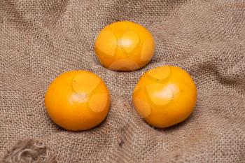 Royalty Free Photo of Tangerines on a Sackcloth