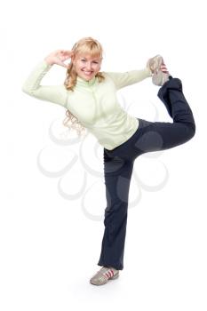 Flexible young woman lifting her leg high up