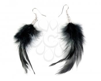 A pair of women's earrings their feathers isolated on white background
