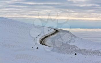 Dirt road in the snowy mountains of Khibiny