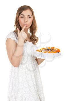 Girl with cake licking fingers, isolate on white