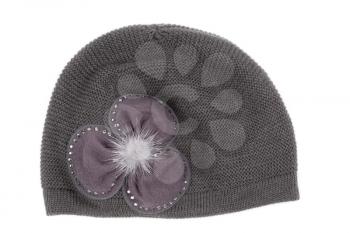 Female gray knitted cap with ornament. Isolate on white.