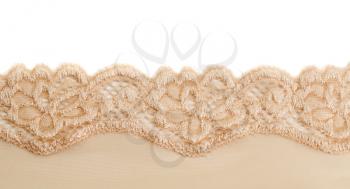 Beige cotton openwork lace. Isolate on white.