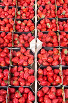 Background of fresh strawberries in boxes.
