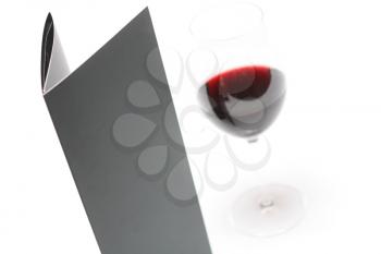 Royalty Free Photo of a Glass of Red Wine and a Menu