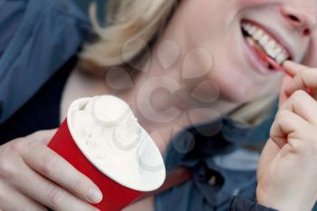 Royalty Free Photo of a Woman Eating Ice Cream