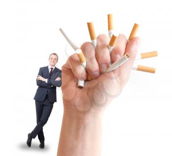 A hand crushing cigarettes and a happy businessman