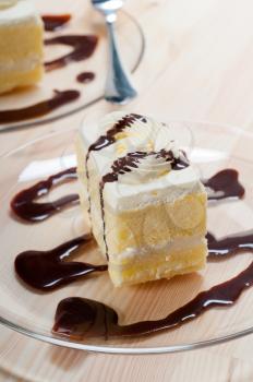 fresh cream cake closeup with chocolate sauce topping 