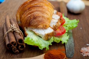 savory croissant brioche bread with chicken breast and vegetable rustic style 