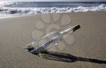 Royalty Free Photo of a Message a Bottle at the Beach