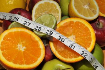 Royalty Free Photo of Fruit and Measuring Tape