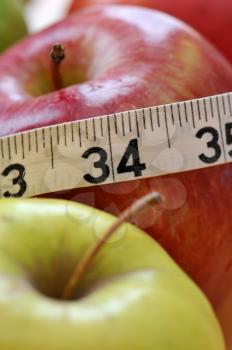 Royalty Free Photo of Apples and Measuring Tape