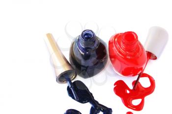 Royalty Free Photo of Bottles of Spilled Nail Polish