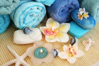 Royalty Free Photo of Candles by Towels