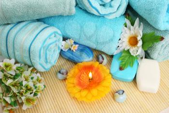 Royalty Free Photo of Soaps by Towels