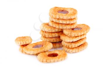 Sweet cookies with jam on gray plate on white background.
