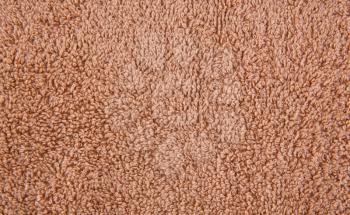 Brown towel texture as a background, closeup picture.