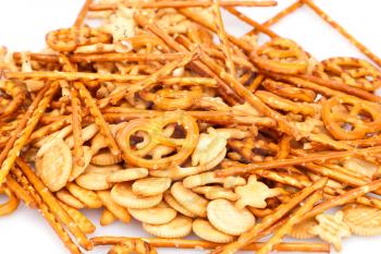 Different salted crackers on white background.