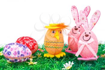 Easter eggs and bunnies decoration on artificial grass.