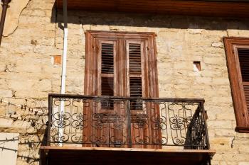 Old wooden door with balcony in Limassol, Cyprus.