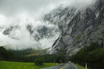 Landscape with rocky mountains and road in Norway.