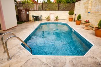 Swimming pool with mosaic pattern.