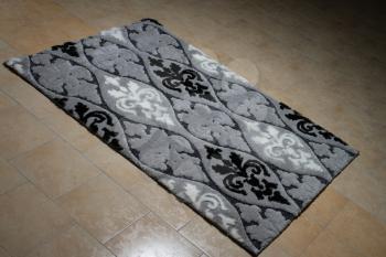 Pattern Carpet Lying On Floor