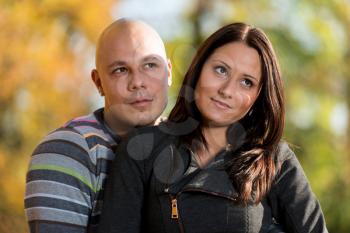 Couple Enjoying In The Beautiful Autumn Day