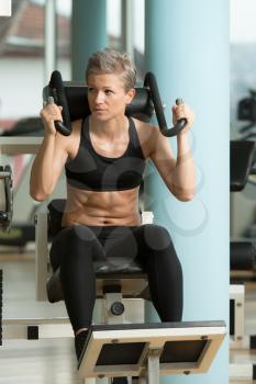 Attractive Woman Athlete Performing Exercise For Abdominal Muscles