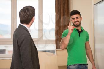 Young Arabic Student Threatens Teacher At The Classroom In Front Of The Whiteboard