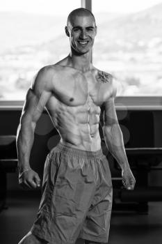 Portrait Of A Young Physically Fit Man Showing His Well Trained Body - Muscular Athletic Bodybuilder Fitness Model Posing After Exercises