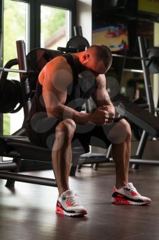 Healthy Bodybuilder Resting In Healthy Club After Exercising