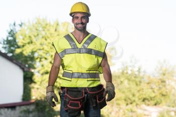 Portrait Of Handsome Male Architect Engineer With Yellow Helmet