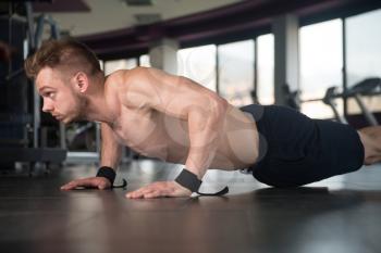 Young Adult Athlete Doing Push Ups As Part Of Bodybuilding Training