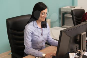 Portrait Of A Cheerful Casual Businesswoman Smiling