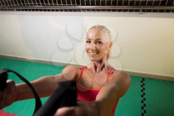 Fitness Woman Exercise Push-ups With Trx Fitness Straps in the Gym