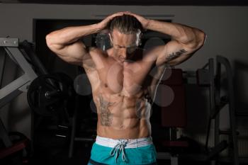 Healthy Mature Tattoo Man Standing Strong In The Gym And Flexing Muscles - Muscular Athletic Bodybuilder Fitness Model Posing After Exercises