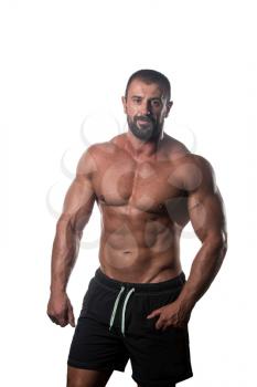 Muscular Young Man Posing In Studio - Isolated On White Background