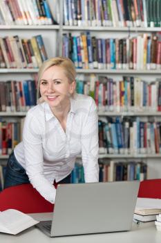 Student Preparing Exam and Learning Lessons in School Library - Making Research on Laptop and Browse Internet in the Library