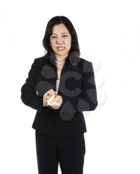 Mature woman showing frustration with crushed paper in hands on white background