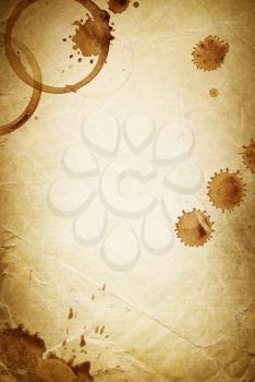 Classic vintage background. Old paper sheet with drops of coffee.