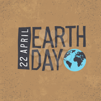 Earth day, 22 April text with globe symbol on cardboard  texture background. 