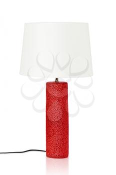 Red table lamp isolated on a white background. Closeup.