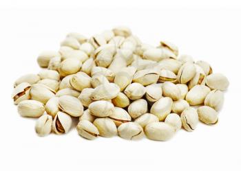 Dry salted pistachios isolated on white background.