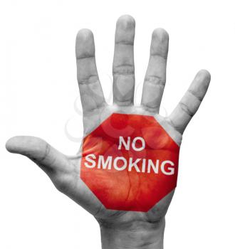 Royalty Free Photo of a Raised Hand With No Smoking Painted on It