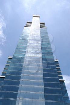 Modern glass skyscraper in the middle of Panama City