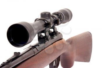 Macro shot of a rifle with a scope on top