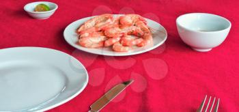 Fresh delicious prawns served on white plate in vietnamese restaurant